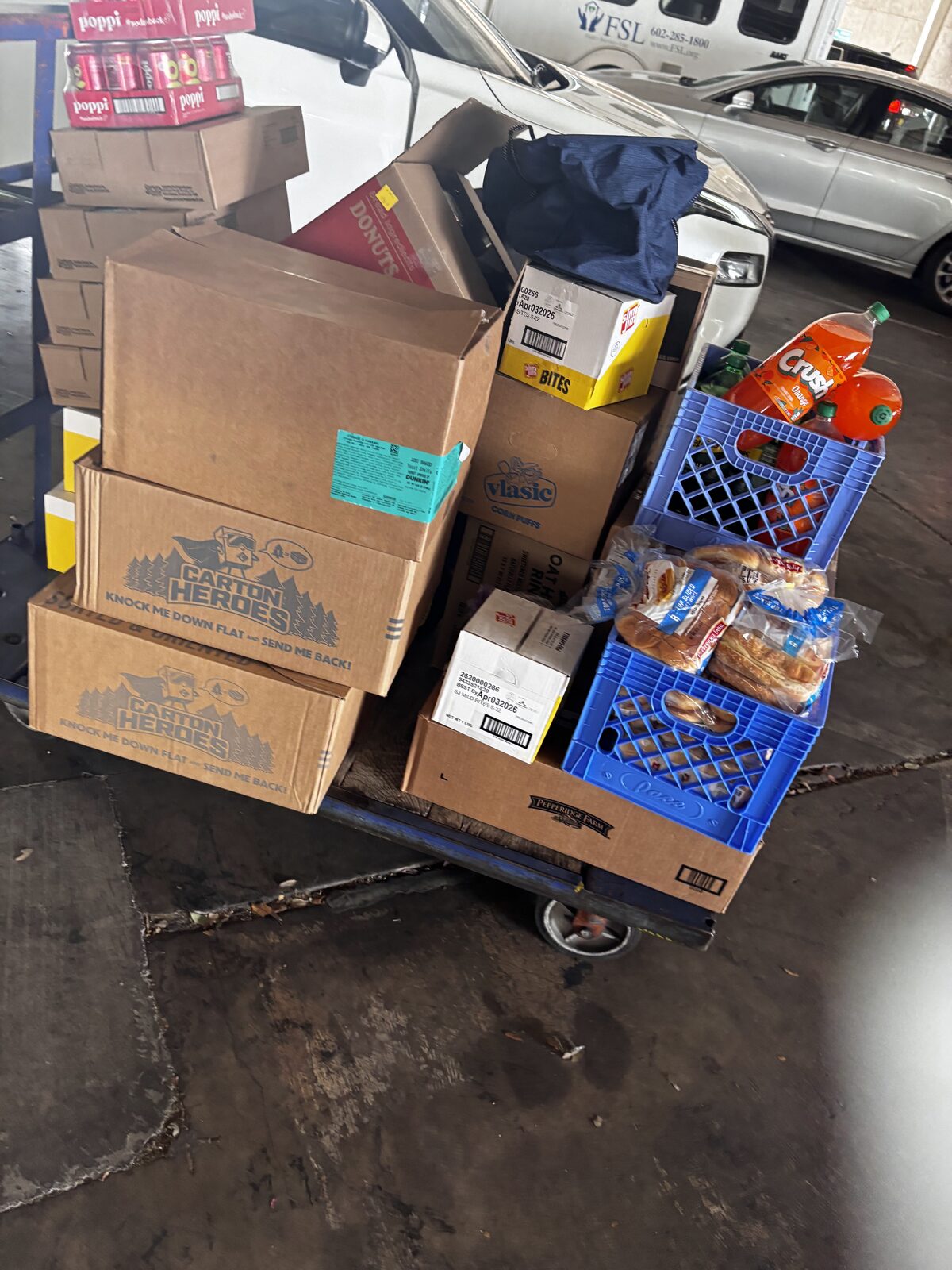 A cart loaded with groceries ready for community food distribution